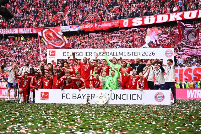 16 May 2026, Bavaria, Munich: Bayern team celebrates winning the German championship with the championship trophy after the German Bundesliga soccer match between Bayern Munich and 1. FC Cologne at Allianz Arena. Photo: Tom Weller/dpa - IMPORTANT NOTICE: DFL and DFB regulations prohibit any use of photographs as image sequences and/or quasi-video.