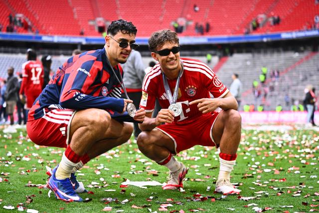 16 May 2026, Bavaria, Munich: Bayern Munich's Aleksandar Pavlovic (L) and Tom Bischof celebrate winning the German championship after the German Bundesliga soccer match between Bayern Munich and 1. FC Cologne at Allianz Arena. Photo: Tom Weller/dpa - IMPORTANT NOTICE: DFL and DFB regulations prohibit any use of photographs as image sequences and/or quasi-video.