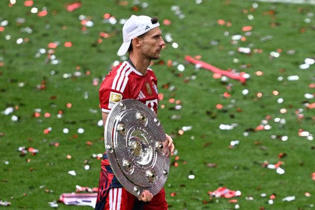 16 May 2026, Bavaria, Munich: Bayern Munich's Leon Goretzka celebrates with the championship trophy after the German Bundesliga soccer match between Bayern Munich and 1. FC Cologne at Allianz Arena. Photo: Sven Hoppe/dpa - IMPORTANT NOTICE: DFL and DFB regulations prohibit any use of photographs as image sequences and/or quasi-video.