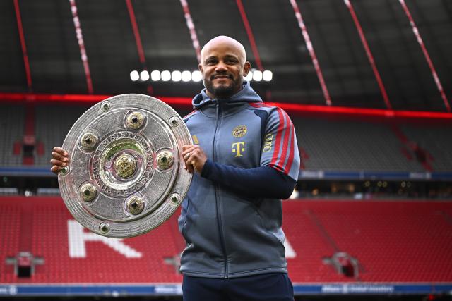 16 May 2026, Bavaria, Munich: Bayern Munich coach Vincent Kompany celebrates winning the German championship with the trophy after the German Bundesliga soccer match between Bayern Munich and 1. FC Cologne at Allianz Arena. Photo: Tom Weller/dpa - IMPORTANT NOTICE: DFL and DFB regulations prohibit any use of photographs as image sequences and/or quasi-video.