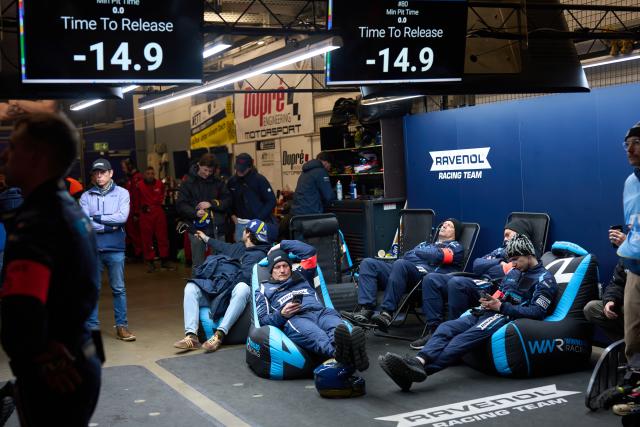 16 May 2026, Rhineland-Palatinate, Nuremberg: A pit crew takes a break during the 24-hour race at the Nuerburgring. Photo: Thomas Frey/dpa
