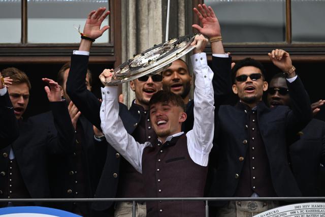 17 May 2026, Bavaria, Munich: Bayern Munich's Lennart Karl celebrates with the trophy on the town hall balcony during the German Bundesliga championship celebrations at Marienplatz. Photo: Sven Hoppe/dpa