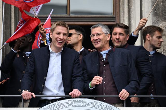 17 May 2026, Bavaria, Munich: Mayor of Munich Dominik Krause (L) and President of FC Bayern Munich Herbert Hainer celebrate on the town hall balcony during the German Bundesliga championship celebrations at Marienplatz. Photo: Sven Hoppe/dpa