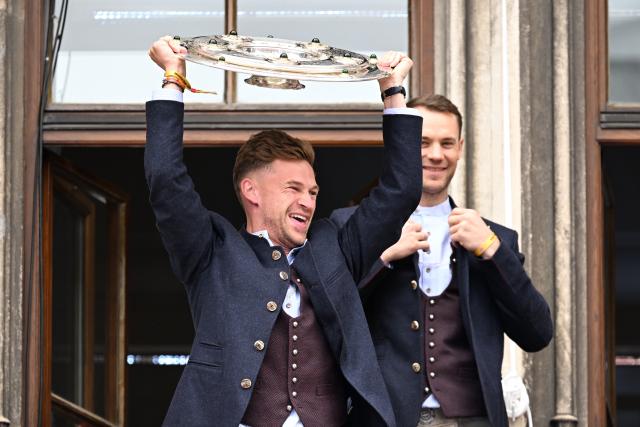 17 May 2026, Bavaria, Munich: Bayern Munich's Joshua Kimmich celebrates with the trophy on the town hall balcony during the German Bundesliga championship celebrations at Marienplatz. Photo: Sven Hoppe/dpa