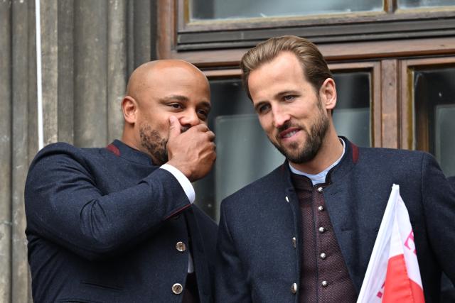 17 May 2026, Bavaria, Munich: Bayern Munich coach Vincent Kompany (L) and Harry Kane celebrate on the town hall balcony during the German Bundesliga championship celebrations at Marienplatz. Photo: Sven Hoppe/dpa