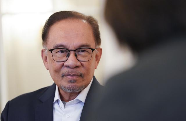 FILED - 15 March 2024, Hamburg: FILE PHOTO - Malaysian Prime Minister Anwar Ibrahim, speaks during an interview with the German Press Agency (DPA) at the Hotel Atlantic Hamburg. Photo: Marcus Brandt/dpa