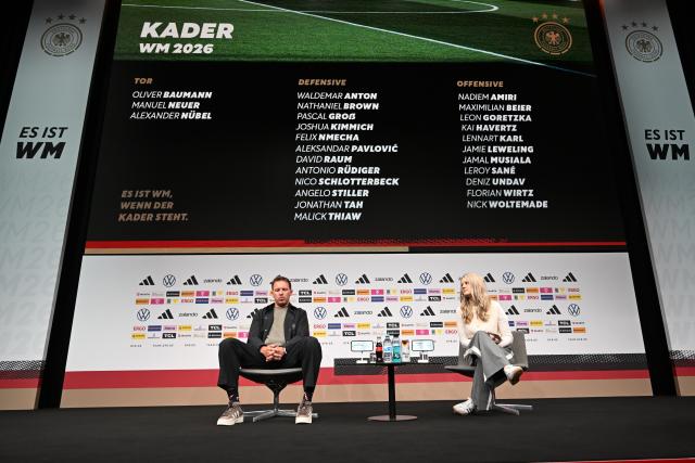 21 May 2026, Hesse, Frankfurt: German national football coach Julian Nagelsmann and DFB press officer Franziska Wuelle sit on stage during a press conference to announce the official squad for the upcoming 2026 FIFA World Cup. The global tournament takes place across Canada, Mexico and the United States from 11 June to 19 July 2026. Photo: Federico Gambarini/dpa