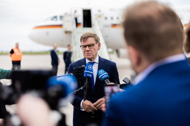 21 May 2026, Brandenburg, Schoenefeld: Johann Wadephul, Germany's Foreign Minister, speaks to members of the media at the military section of Berlin Brandenburg Airport before departing for the North Atlantic Treaty Organization foreign ministers' meeting in Sweden. Photo: Christoph Soeder/dpa