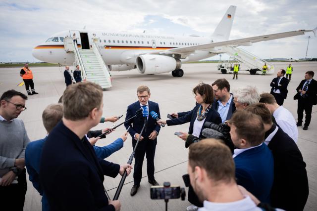 21 May 2026, Brandenburg, Schoenefeld: Johann Wadephul, Germany's Foreign Minister, speaks to members of the media at the military section of Berlin Brandenburg Airport before departing for the North Atlantic Treaty Organization foreign ministers' meeting in Sweden. Photo: Christoph Soeder/dpa