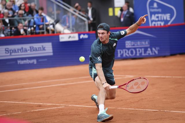 21 May 2026, Hamburg: American tennis player Tommy Paul plays a backhand return against
Germany's Daniel Altmaier during their Men's Singles Quarterfinals tennis match. Photo: Christian Charisius/dpa