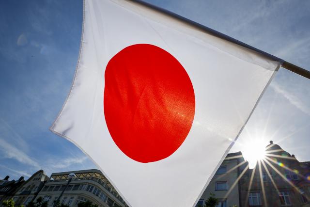 23 May 2026, North Rhine-Westphalia, Duesseldorf: A Japanese flag flutters in the wind on Japan Day. Duesseldorf is considered a hub of the Japanese community in Germany. Photo: Thomas Banneyer/dpa