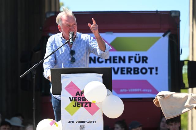 23 May 2026, Bavaria, Munich: Comedian Christian Springer speaks during the nationwide day of action "Defend Human Dignity - Ban the Alternative for Germany Now!" at Koenigsplatz square. Photo: Felix Hörhager/dpa