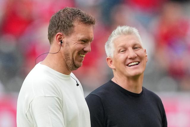 23 May 2026, Berlin: Bastian Schweinsteiger (R) and Germany national team coach Julian Nagelsmann walk on the pitch ahead of the German DFB Cup Final soccer match between Bayern Munich and VfB Stuttgart at Berlin Olympic Stadium. Photo: Michael Kappeler/dpa