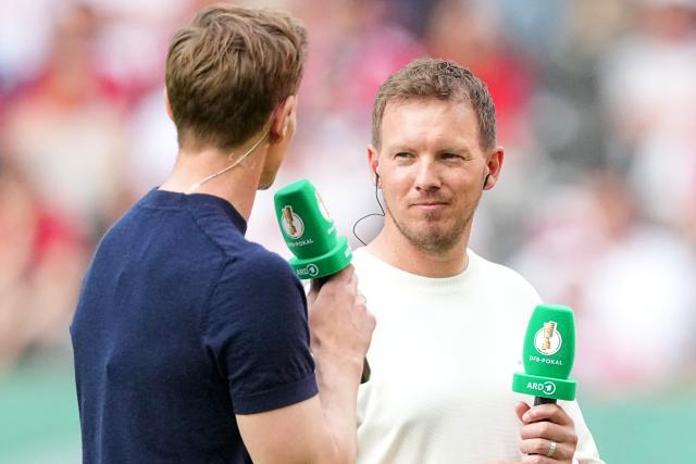 23 May 2026, Berlin: Germany National Team Coach Julian Nagelsmann (R) speaks with Alexander Schlueter, the host, ahead of the German DFB Cup Final soccer match between Bayern Munich and VfB Stuttgart at Berlin Olympic Stadium. Photo: Michael Kappeler/dpa