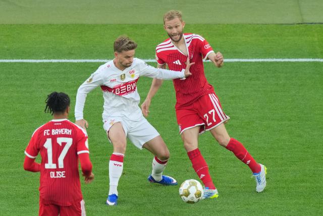 23 May 2026, Berlin: Stuttgart's Maximilian Mittelstaedt (L) and Bayern Munich's Konrad Laimer (R) battle for the ball during the German DFB Cup Final between Bayern Munich and VfB Stuttgart at the Olympic Stadium in Berlin. Photo: Soeren Stache/dpa