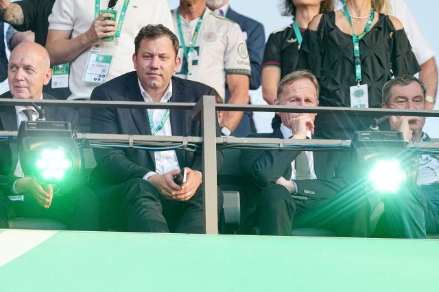 23 May 2026, Berlin: (L-R) Bernd Neuendorf, DFB President, Lars Klingbeil, Germany's Minister of Finance, Hans-Joachim Watzke, DFB Vice President, and Markus Soeder, Minister-President of Bavaria, sit in their seats during the German DFB Cup Final between Bayern Munich and VfB Stuttgart at the Olympic Stadium in Berlin. Photo: Michael Kappeler/dpa