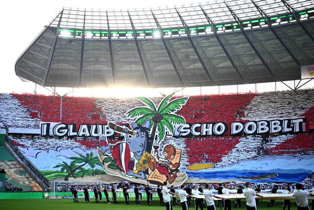 23 May 2026, Berlin: Stuttgart fans celebrate their team during the German DFB Cup Final between Bayern Munich and VfB Stuttgart at the Olympic Stadium in Berlin. Photo: Tom Weller/dpa