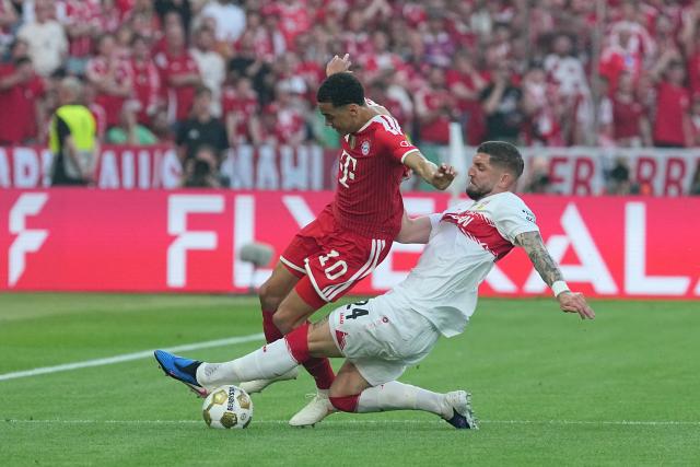 23 May 2026, Berlin: Bayern Munich's Jamal Musiala (L) and Stuttgart's Jeff Chabot battle for the ball during the German DFB Cup Final between Bayern Munich and VfB Stuttgart at the Olympic Stadium in Berlin. Photo: Michael Kappeler/dpa