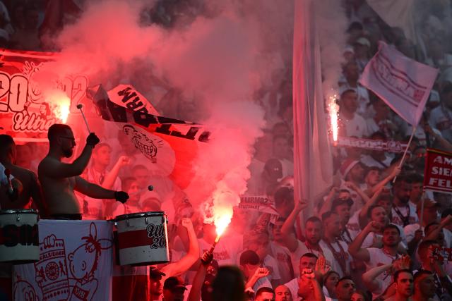 23 May 2026, Berlin: Stuttgart fans set off pyrotechnics during the German DFB Cup Final between Bayern Munich and VfB Stuttgart at the Olympic Stadium in Berlin. Photo: Sebastian Gollnow/dpa