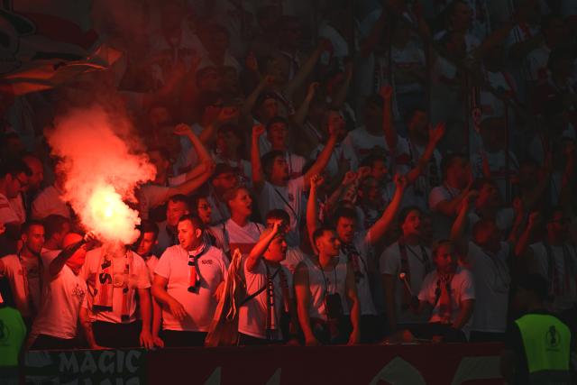 23 May 2026, Berlin: Stuttgart fans set off pyrotechnics during the German DFB Cup Final between Bayern Munich and VfB Stuttgart at the Olympic Stadium in Berlin. Photo: Sebastian Gollnow/dpa