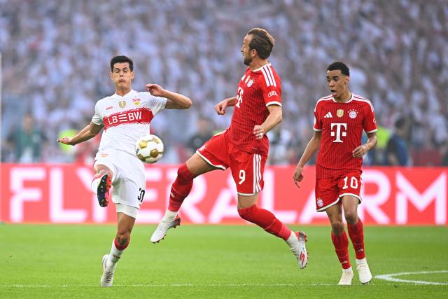 23 May 2026, Berlin: Stuttgart's Chema Andres (L) and Bayern Munich's Harry Kane and Bayern Munich's Jamal Musiala (R) battle for the ball during the German DFB Cup Final between Bayern Munich and VfB Stuttgart at the Olympic Stadium in Berlin. Photo: Tom Weller/dpa