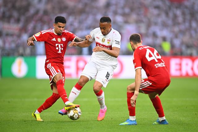 23 May 2026, Berlin: Bayern Munich's Luis Diaz (L) and Bayern Munich's Josip Stanisic (R) battle for the ball with Stuttgart's Jamie Leweling during the German DFB Cup Final between Bayern Munich and VfB Stuttgart at the Olympic Stadium in Berlin. Photo: Tom Weller/dpa