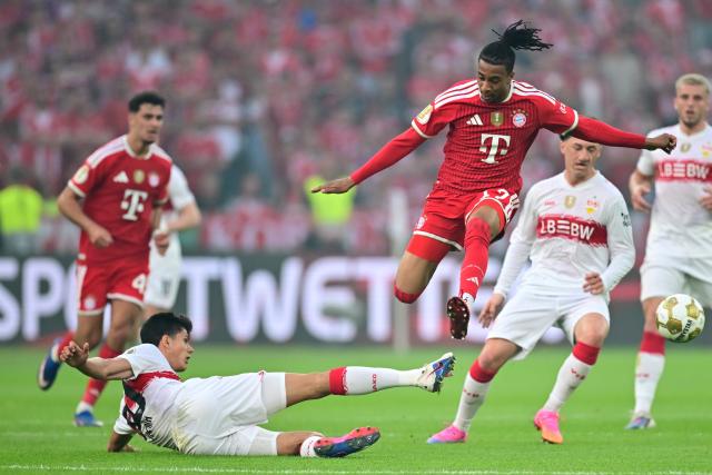23 May 2026, Berlin: Stuttgart's Chema Andres (L) and Bayern Munich's Michael Olise battle for the ball during the German DFB Cup Final between Bayern Munich and VfB Stuttgart at the Olympic Stadium in Berlin. Photo: Sebastian Gollnow/dpa