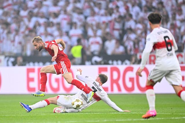 23 May 2026, Berlin: Bayern Munich's Konrad Laimer (L) and Stuttgart's Maximilian Mittelstaedt battle for the ball during the German DFB Cup Final between Bayern Munich and VfB Stuttgart at the Olympic Stadium in Berlin. Photo: Tom Weller/dpa