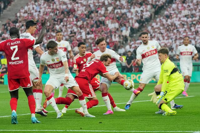 23 May 2026, Berlin: Bayern Munich's Harry Kane (C) and Stuttgart's Angelo Stiller (4th R) battle for the ball during the German DFB Cup Final between Bayern Munich and VfB Stuttgart at the Olympic Stadium in Berlin. Photo: Michael Kappeler/dpa
