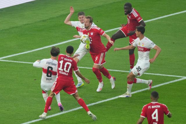 23 May 2026, Berlin: Bayern Munich's Harry Kane (C) and Stuttgart's Finn Jeltsch (top L) battle for the ball during the German DFB Cup Final between Bayern Munich and VfB Stuttgart at the Olympic Stadium in Berlin. Photo: Soeren Stache/dpa