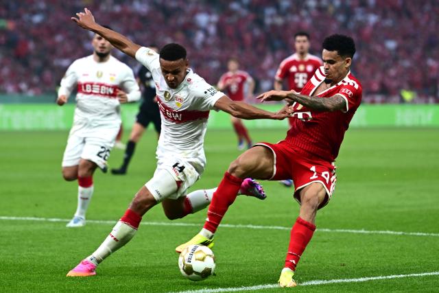 23 May 2026, Berlin: Stuttgart's Luca Jaquez (L) and Bayern Munich's Luis Diaz battle for the ball during the German DFB Cup Final between Bayern Munich and VfB Stuttgart at the Olympic Stadium in Berlin. Photo: Sebastian Gollnow/dpa