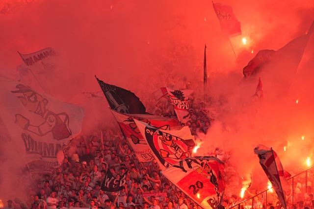 23 May 2026, Berlin: Stuttgart fans set off fireworks during the German DFB Cup Final between Bayern Munich and VfB Stuttgart at the Olympic Stadium in Berlin. Photo: Michael Kappeler/dpa