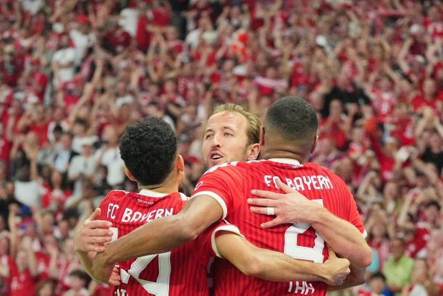 23 May 2026, Berlin: Bayern Munich's Harry Kane (C) celebrates after scoring his side's first goal of the game with teammates Luis Diaz (L) and Jonathan Tah during the German DFB Cup Final between Bayern Munich and VfB Stuttgart at the Olympic Stadium in Berlin. Photo: Michael Kappeler/dpa