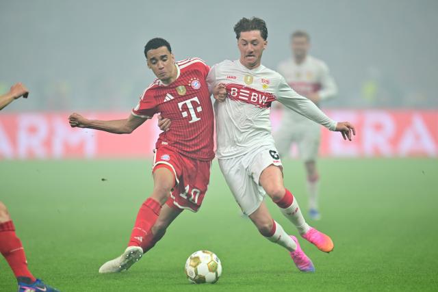 23 May 2026, Berlin: Bayern Munich's Jamal Musiala (L) and Stuttgart's Angelo Stiller battle for the ball during the German DFB Cup Final between Bayern Munich and VfB Stuttgart at the Olympic Stadium in Berlin. Photo: Sebastian Gollnow/dpa
