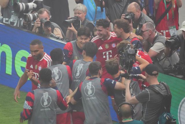 23 May 2026, Berlin: The Bayern Munich players celebrate their side's second goal of the game during the German DFB Cup Final between Bayern Munich and VfB Stuttgart at the Olympic Stadium in Berlin. Photo: Soeren Stache/dpa