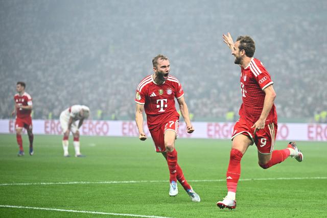 23 May 2026, Berlin: Bayern Munich's Harry Kane Harry Kane (R) celebrates after scoring his side's second goal of the game with Konrad Laimer during the German DFB Cup Final between Bayern Munich and VfB Stuttgart at the Olympic Stadium in Berlin. Photo: Tom Weller/dpa