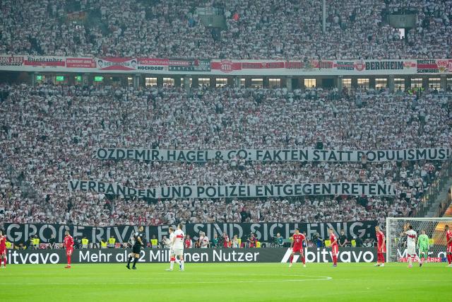 23 May 2026, Berlin: Stuttgart fans hold up banners during the German DFB Cup Final between Bayern Munich and VfB Stuttgart at the Olympic Stadium in Berlin. Photo: Michael Kappeler/dpa