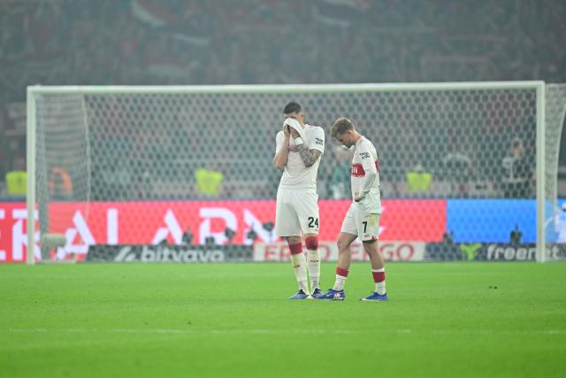23 May 2026, Berlin: Stuttgart's Jeff Chabot (L) and Maximilian Mittelstaedt react after losing the German DFB Cup Final to Bayern Munich at the Olympic Stadium in Berlin. Photo: Sebastian Gollnow/dpa
