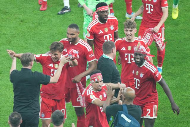 23 May 2026, Berlin: Bayern Munich players celebrate winning the German DFB Cup Final against VfB Stuttgart at the Olympic Stadium in Berlin. Photo: Soeren Stache/dpa