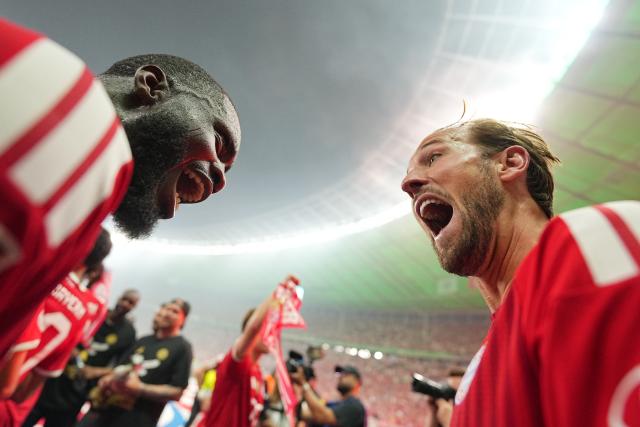 23 May 2026, Berlin: Bayern Munich's Harry Kane (R) and Bayern Munich's Dayot Upamecano celebrate winning the German DFB Cup Final against VfB Stuttgart at the Olympic Stadium in Berlin. Photo: Michael Kappeler/dpa