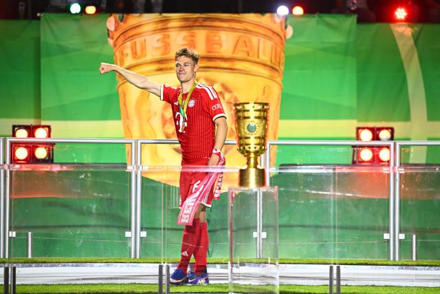 23 May 2026, Berlin: Bayern Munich's Joshua Kimmich stands next to the trophy after winning the German DFB Cup Final against VfB Stuttgart at the Olympic Stadium in Berlin. Photo: Tom Weller/dpa