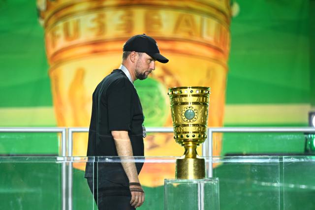 23 May 2026, Berlin: Stuttgart coach Sebastian Hoeness walks past the trophy after lossing the German DFB Cup Final to Bayern Munich at the Olympic Stadium in Berlin. Photo: Tom Weller/dpa