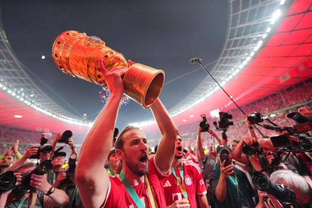 23 May 2026, Berlin: Bayern Munich's Harry Kane celebrates with the trophy after winning the German DFB Cup Final against VfB Stuttgart at the Olympic Stadium in Berlin. Photo: Michael Kappeler/dpa