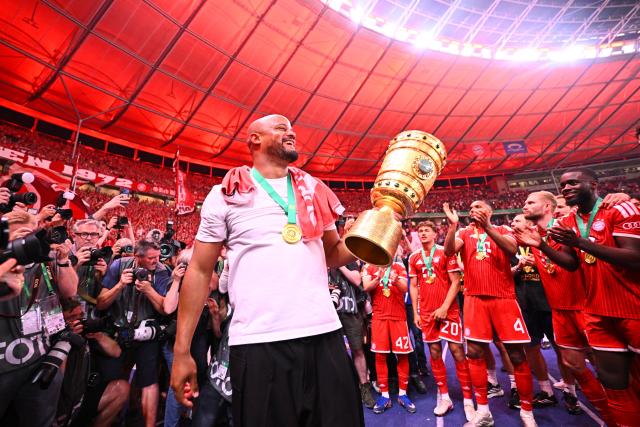 23 May 2026, Berlin: Bayern Munich coach Vincent Kompany celebrates with the trophy after winning the German DFB Cup Final against VfB Stuttgart at the Olympic Stadium in Berlin. Photo: Tom Weller/dpa