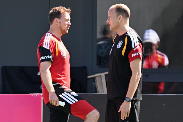 28 May 2026, Bavaria, Herzogenaurach: German National team coach Julian Nagelsmann speaks to team doctor Dr. Jochen Hahne during the team's training session ahead of the 2026 FIFA World Cup kick off match against Curacao in Houston. Photo: Federico Gambarini/dpa