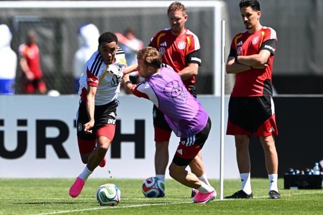 28 May 2026, Bavaria, Herzogenaurach: Germany's Jamal Musiala (L) and Joshua Kimmich battle for the ball during the team's training session ahead of the 2026 FIFA World Cup kick off match against Curacao in Houston. Photo: Federico Gambarini/dpa