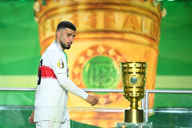 FILED - 23 May 2026, Berlin: FILE PHOTO - Stuttgart's Deniz Undav walks past the trophy after lossing the German DFB Cup Final to Bayern Munich at the Olympic Stadium in Berlin. Photo: Tom Weller/dpa