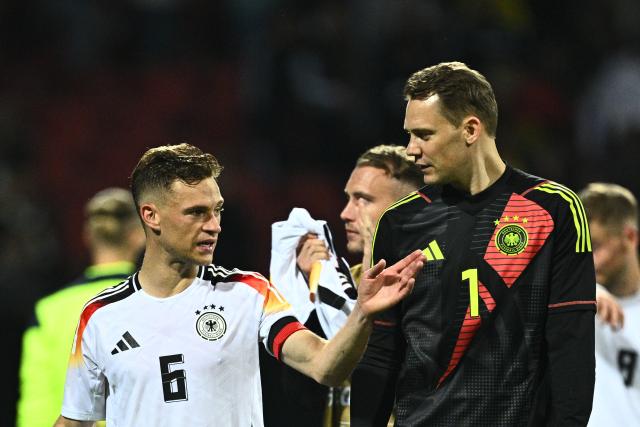 FILED - 03 June 2024, Bavaria, Nuremberg: FILE PHOTO - Germany's Joshua Kimmich and goalkeeper Manuel Neuer (R) speak after the International friendly soccer match between Germany and Ukraine at the Max Morlock Stadium. Photo: Tom Weller/dpa