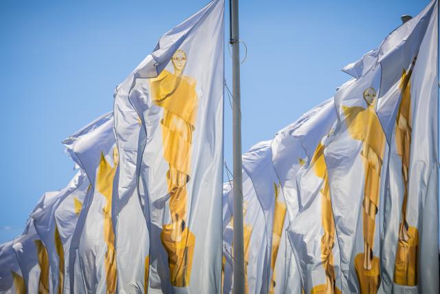 29 May 2026, Berlin: Flags featuring Lola are flying in front of the radio tower at the exhibition center ahead of the German Film Awards ceremony. Photo: Christoph Soeder/dpa