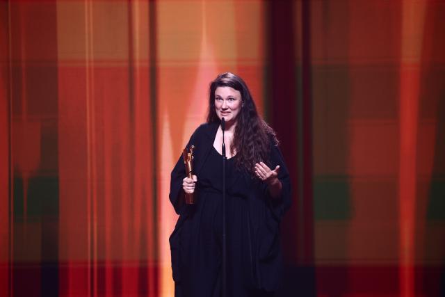 29 May 2026, Berlin: Director Mascha Schilinski poses on stage after winning the Best Director award for her film "Sound of Falling" during the German Film Awards in Berlin. Photo: Christoph Soeder/dpa